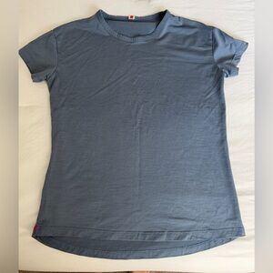 Women’s blue athletic running Tracksmith shirt short sleeve